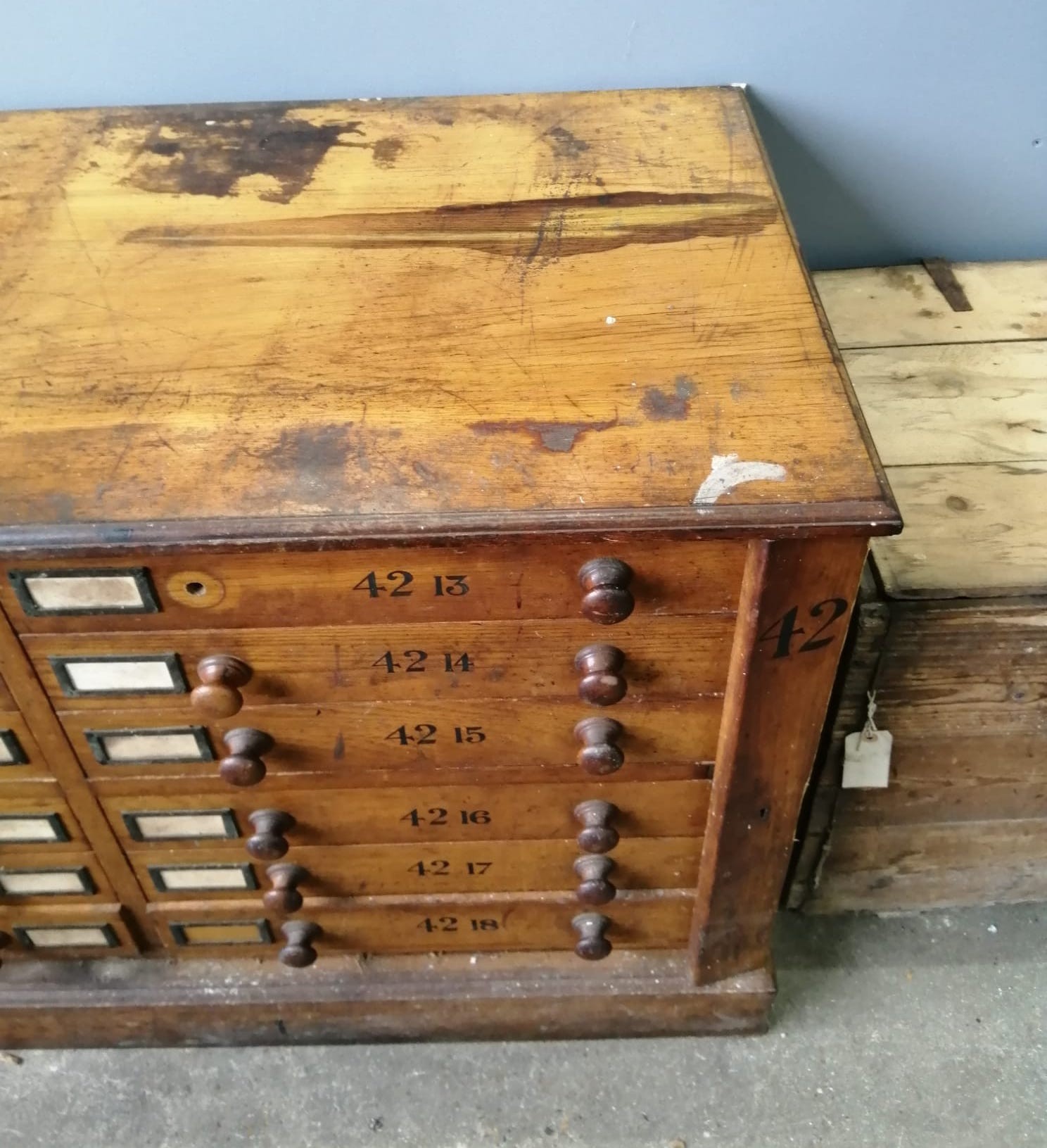 A large Victorian oak geological specimen cabinet, fitted 18 drawers with side locking bars, width 183cm, depth 63cm, height 77cm